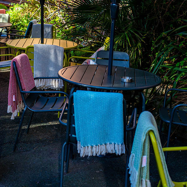 Al fresco seating area with blankets at Café Nucleus Chatham