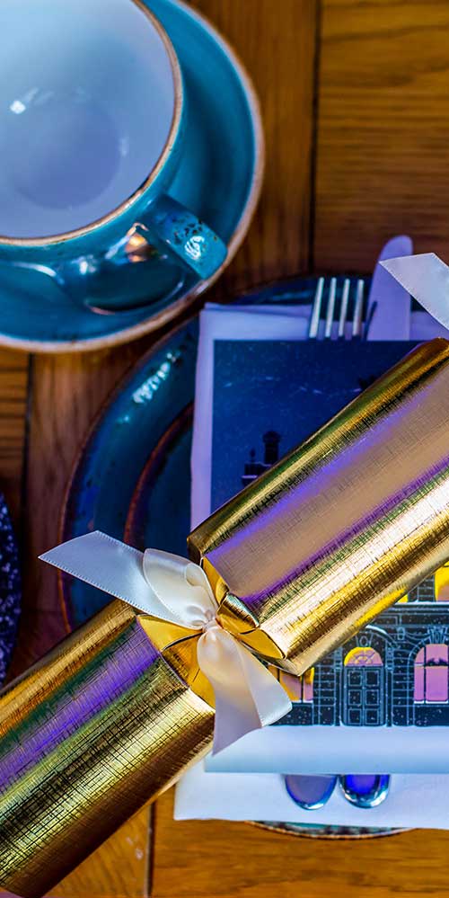 Close up image of a Christmas cracker on our Festive Afternoon Tea menu.